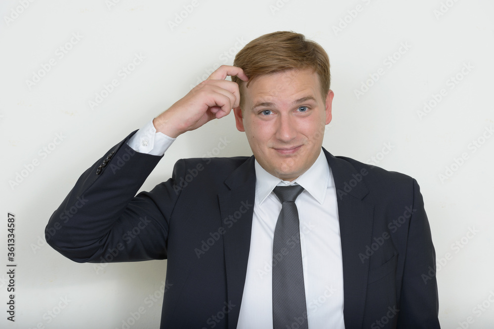 Portrait of businessman with blond hair wearing suit Portrait of businessman with blond hair wearing suit