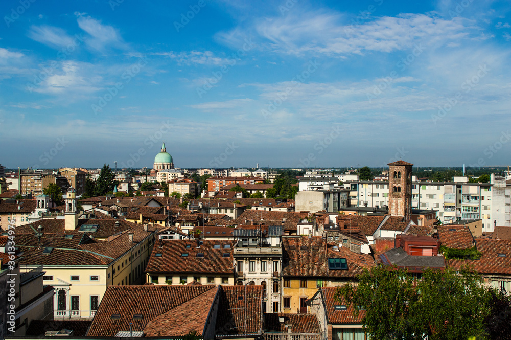 Panoramic view from above with a dome and roofs of the city of Udine, Italy
