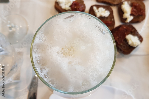 Take off shots of beer glass on the table at the restaurant