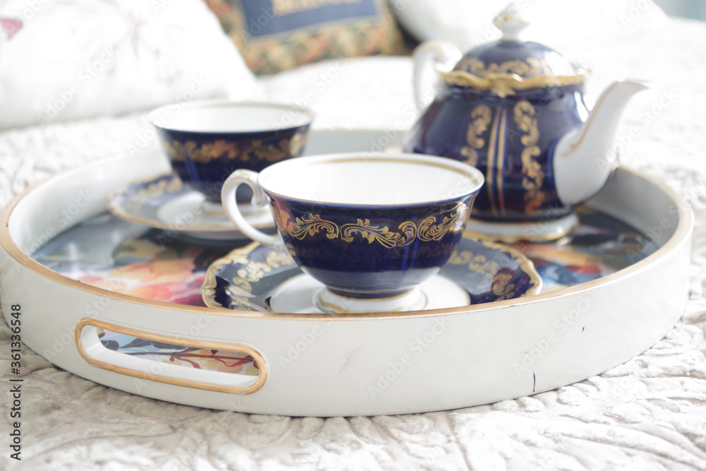 Tray with two cups of espresso coffee on the bed. Morning coffee Tray with two cups of espresso coffee on the bed. Morning coffee