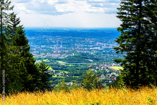 Fototapeta Naklejka Na Ścianę i Meble -  Panoramic view of Bielsko Biala city from the slopes of Magurka in Beskid Maly, Poland. Bielsko is a city located at the foot of the mountains with good tourist infrastructure.