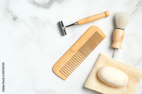 Eco-friendly wooden shaving accessories for man on marble table. Flat lay  top view.