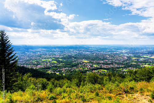 Fototapeta Naklejka Na Ścianę i Meble -  Panoramic view of Bielsko Biala city from the slopes of Magurka in Beskid Maly, Poland. Bielsko is a city located at the foot of the mountains with good tourist infrastructure.