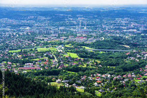 Fototapeta Naklejka Na Ścianę i Meble -  Panoramic view of Bielsko Biala city from the slopes of Magurka in Beskid Maly, Poland. Bielsko is a city located at the foot of the mountains with good tourist infrastructure.