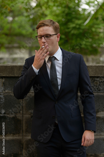 Businessman with blond hair in the streets outdoors