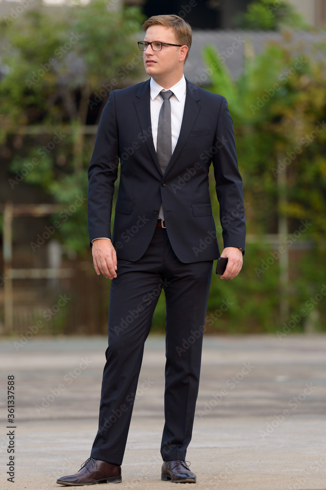 Businessman with blond hair in the streets outdoors Businessman with blond hair in the streets outdoors