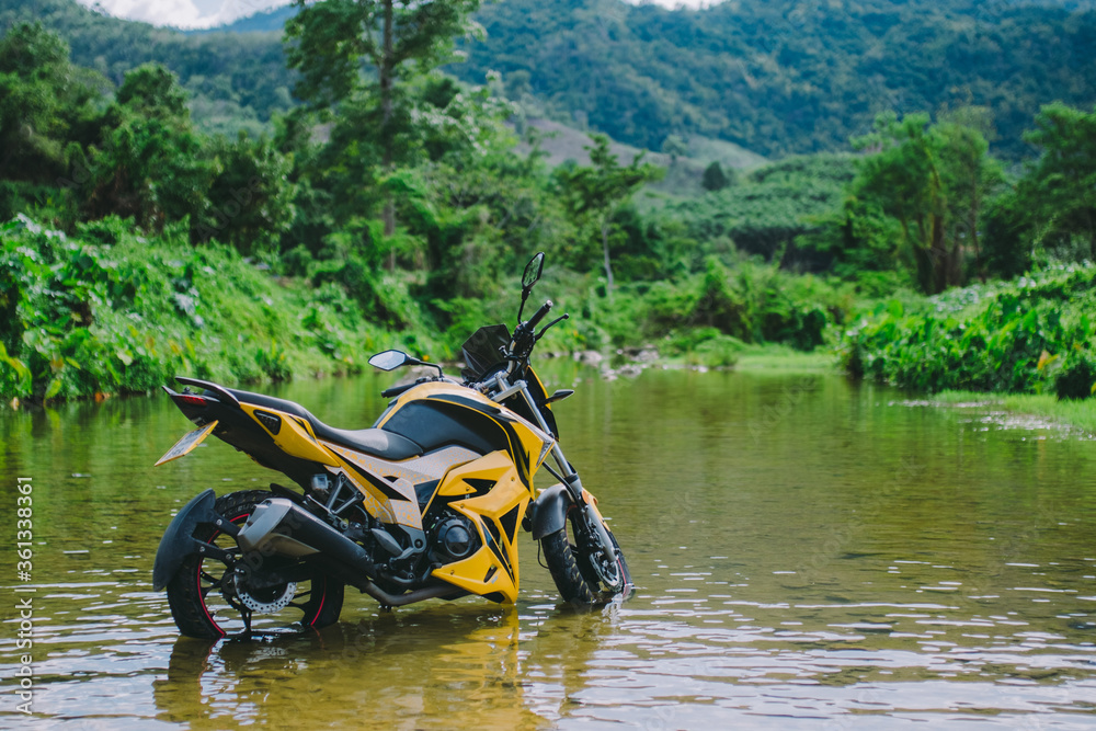 Motorbike in the middle of the river. Motorbike in the middle of the river.