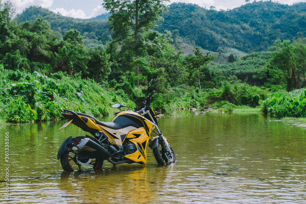 Motorbike in the middle of the river. Motorbike in the middle of the river.