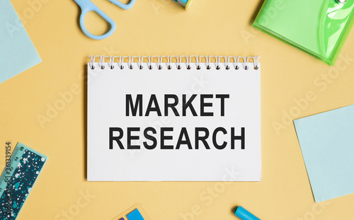 Notebook with Tools and Notes About Market Research