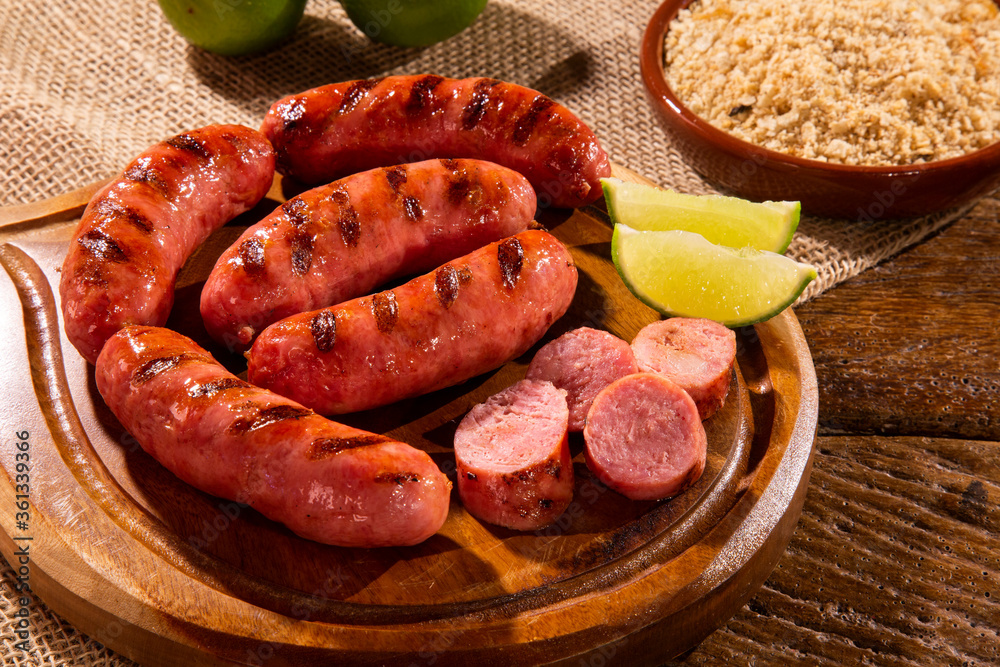 Grilled sausage. Grilled Sausage on wooden board. Brazilian barbecue.