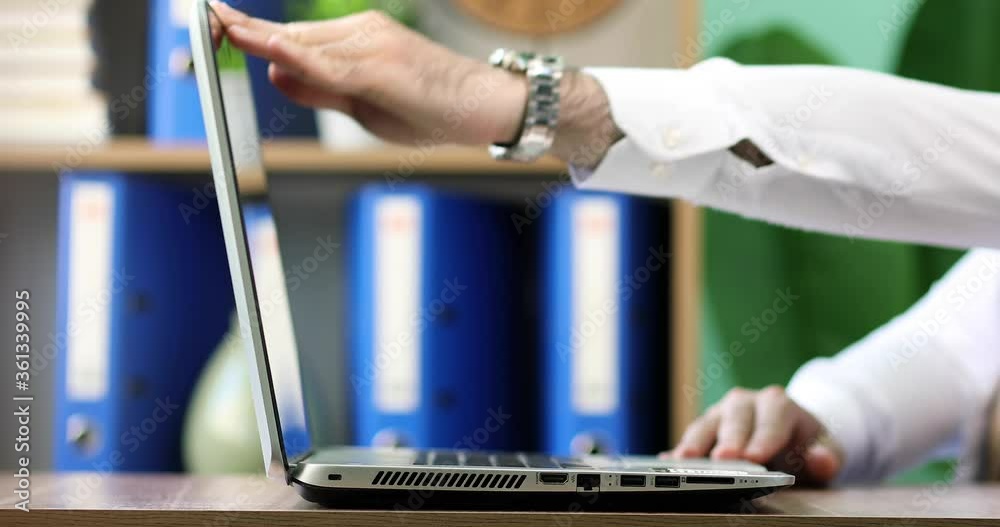 Office man opening a laptop with blur background Stock Video | Adobe Stock