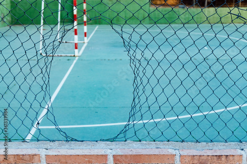 broken in a wire rope to enter to play a soccer. freedom concept