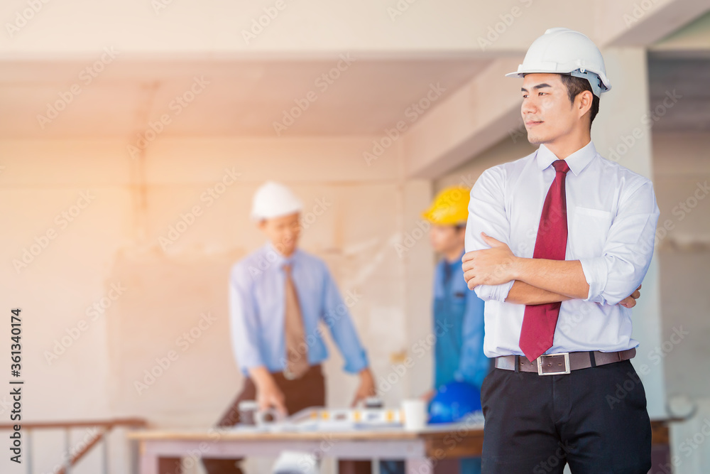 Portrait of handsome engineer with construction site background. Portrait of handsome engineer with construction site background.