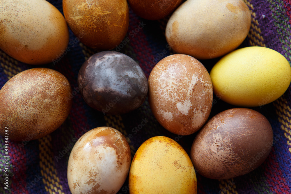 filled frame background wallpaper shot of a bunch of original colorful dragon or dinosaur looking like chicken Easter eggs, dyed with natural products (red wine, tea, coffee, carrots, turmeric) filled frame background wallpaper shot of a bunch of original colorful dragon or dinosaur looking like chicken Easter eggs, dyed with natural products (red wine, tea, coffee, carrots, turmeric)