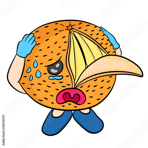 orange fruit with a cartoon face that is crying