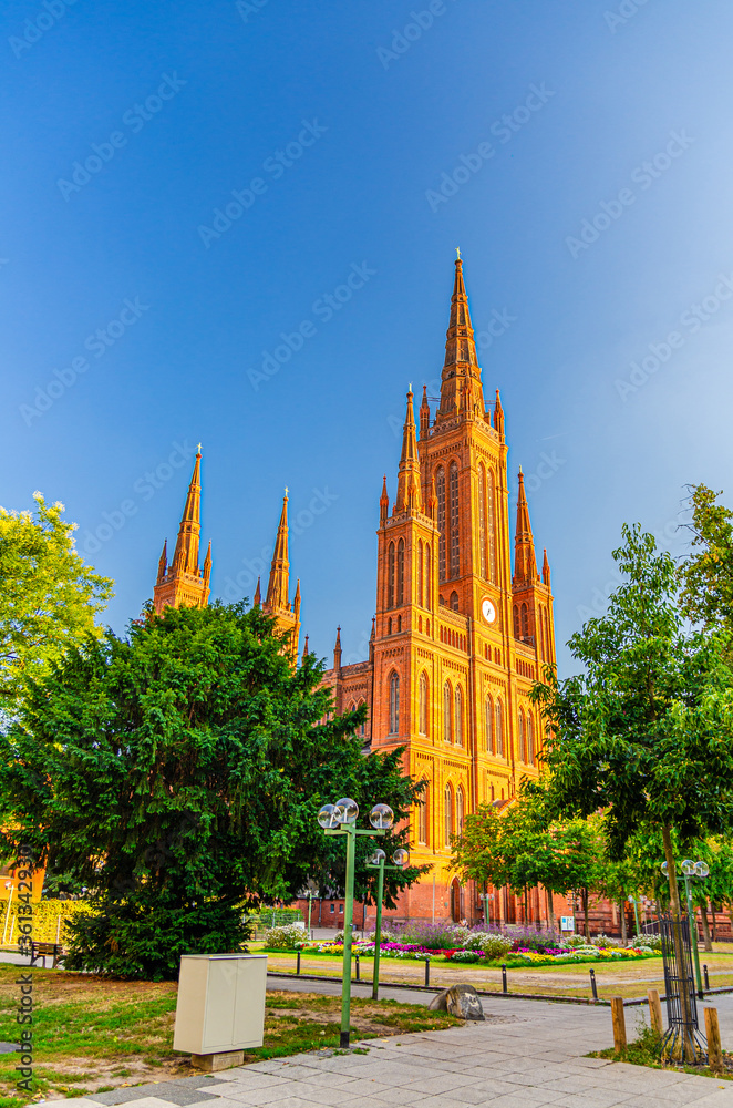 Naklejka premium Evangelical Market Protestant church Wiesbaden or Marktkirche neo-Gothic style building on Schlossplatz Palace Square in historical city centre, blue sky background, State of Hesse, Germany