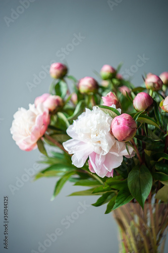 Bouquet of peonies. Pink and white peonies. Macro photo. Selective focus. Artistic style. © Anastasia