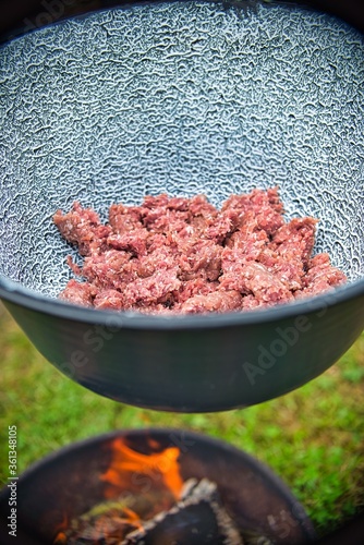 Chopped meat in a fire bowl