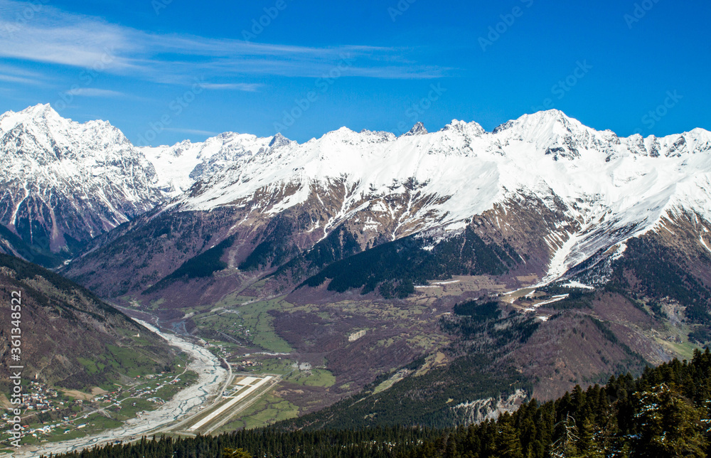 panorama of Georgia mountains river and snow