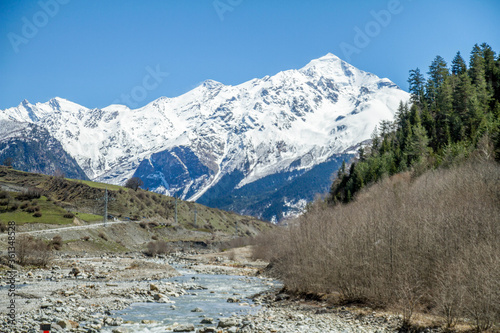 panorama of Georgia mountains river and snow