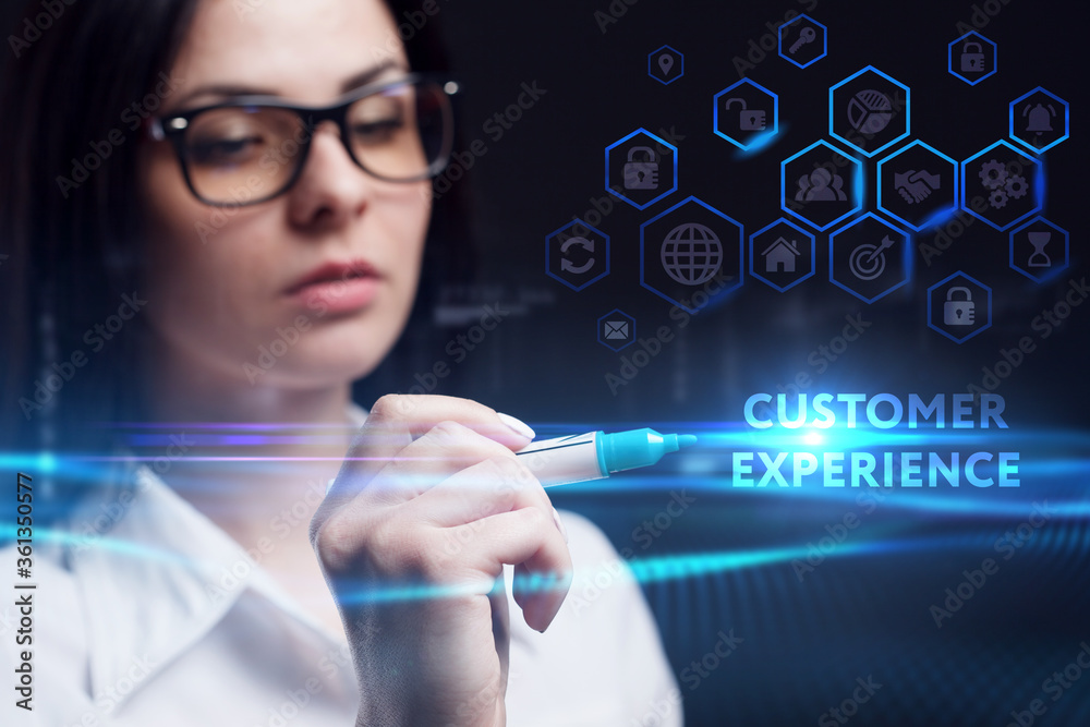 Business, Technology, Internet and network concept. Young businessman working on a virtual screen of the future and sees the inscription: Customer experience Business, Technology, Internet and network concept. Young businessman working on a virtual screen of the future and sees the inscription: Customer experience