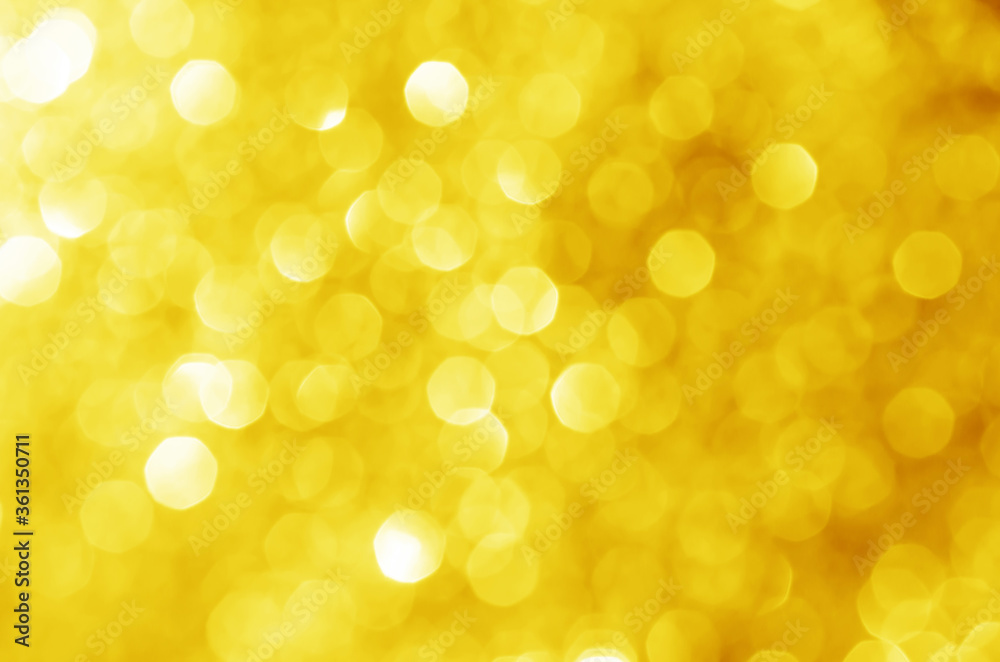 abstract defocused yellow bokeh sparkling light glitter background. for wallpaper backdrop and template.