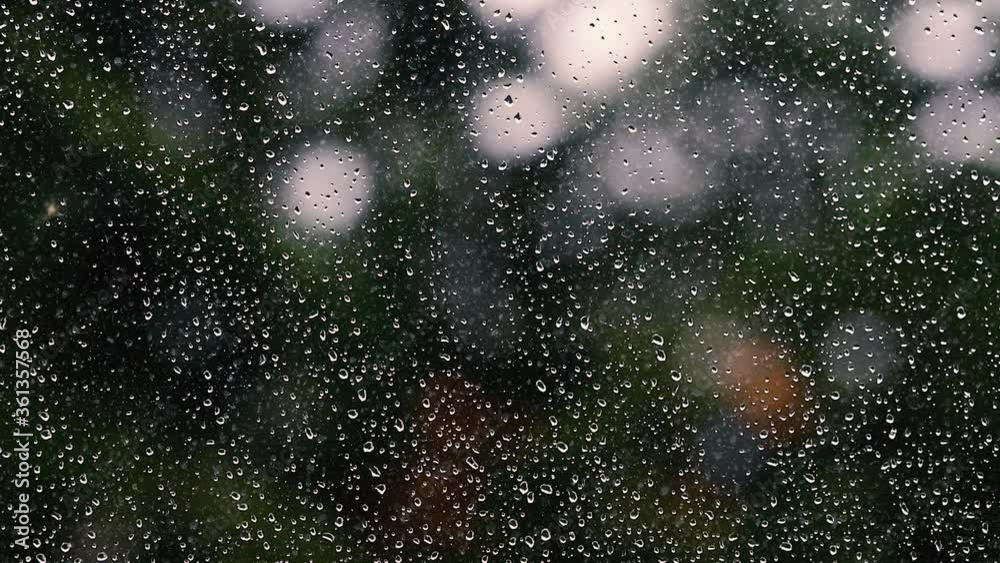rain falling on window surface rain falling on window surface