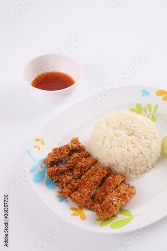 Thai food gourmet fried chicken with rice , khao mun kai in wood background