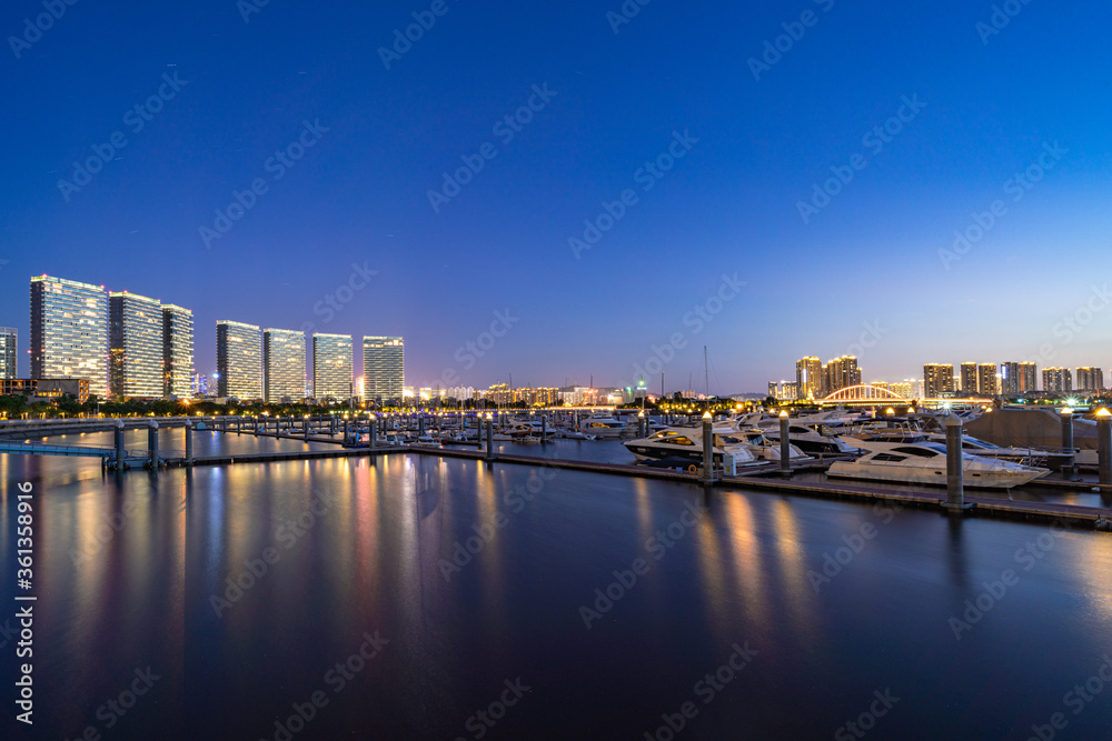 Fototapeta premium Xiamen blue tone skyline synthesized by particle lines