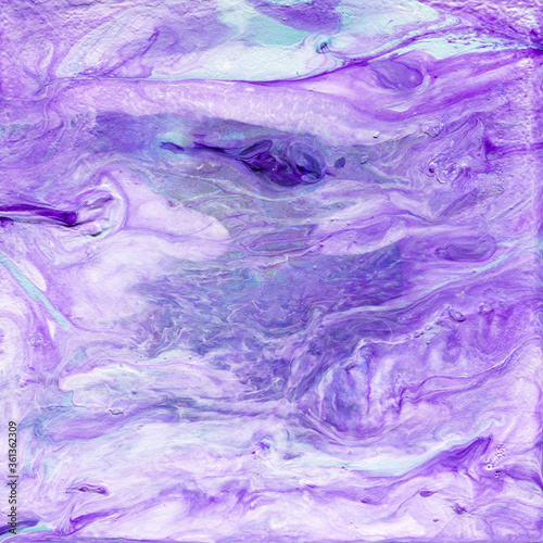Beautiful abstract background. Acrylic pouring paints. Marble texture. Contemporary art. Luxury abstract fluid art painting, mixture of blue and purple paints. Imitation of marble stone cut, sea.