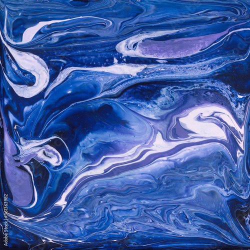 Beautiful abstract background. Acrylic pouring paints. Marble texture. Contemporary art. Luxury abstract fluid art painting, mixture of blue and purple paints. Imitation of marble stone cut, sea. © clesmoon