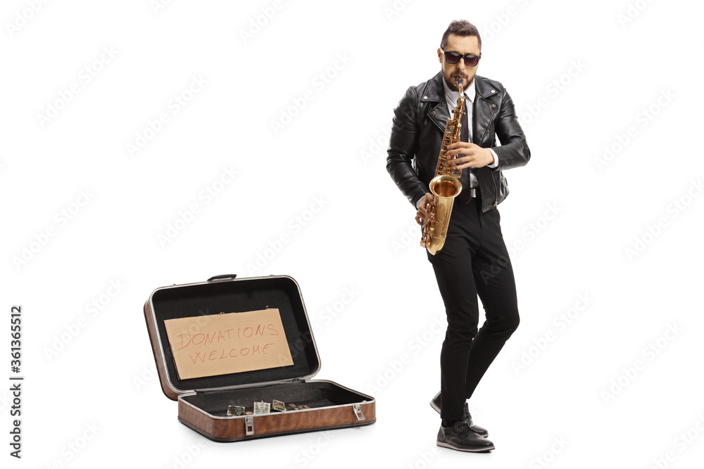 Naklejka premium Man playing a saxophone with a suitcase for donations