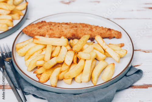 Fototapeta Naklejka Na Ścianę i Meble -  Traditional English Food such as Fish and Chips with green peas served in the Pub or Restaurant