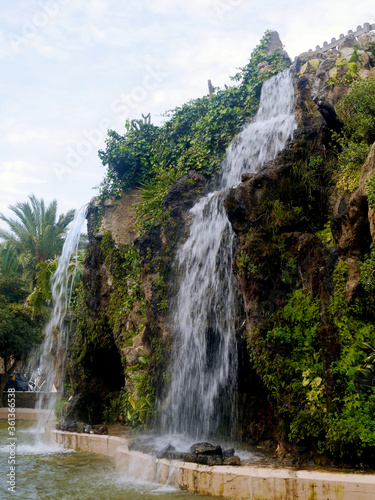 Water falls in the Genoves Park in the bay of Cadiz capital. Andalusia. Spain. Europe.