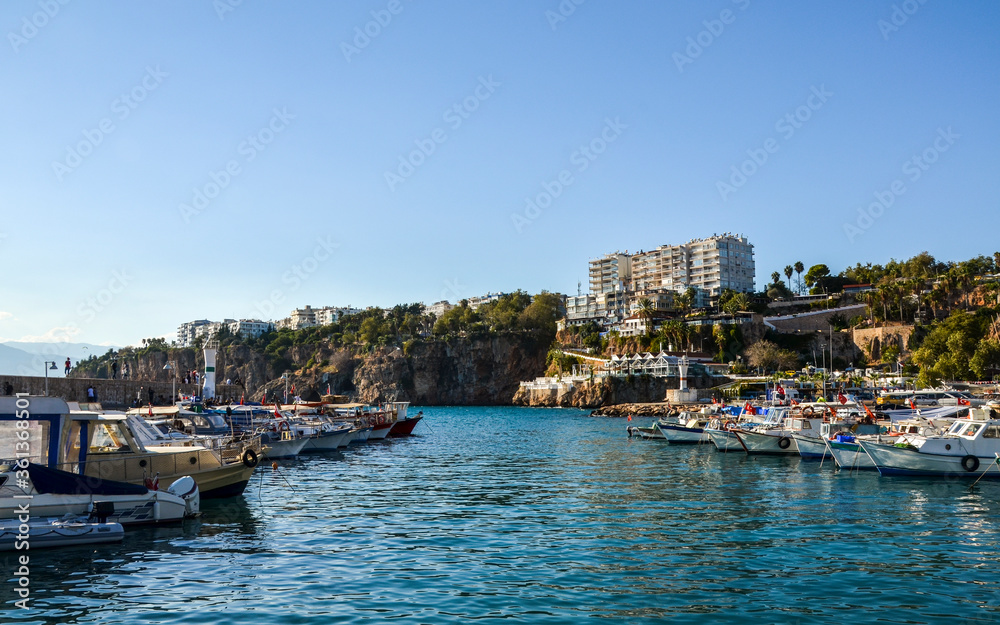 View of fishing boats and yachts moored in old marina of Antalya, Kaleici, Turkey. Popular tourist place