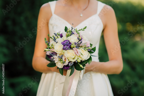 Beautiful beautiful wedding bouquet for the bride newlyweds at the event for engagement in the hands of roses and flowers model woman