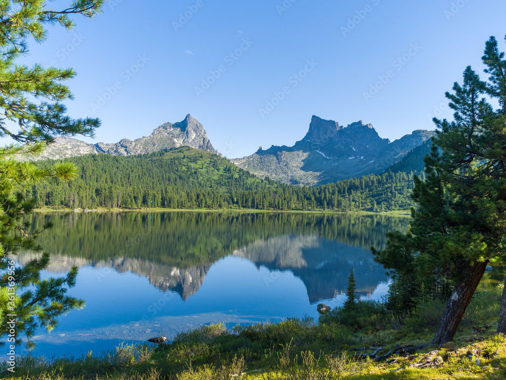 Light lake in the Ergaki nature park. Siberian mountains of the Sayan Mountains. View of the peaks of 
