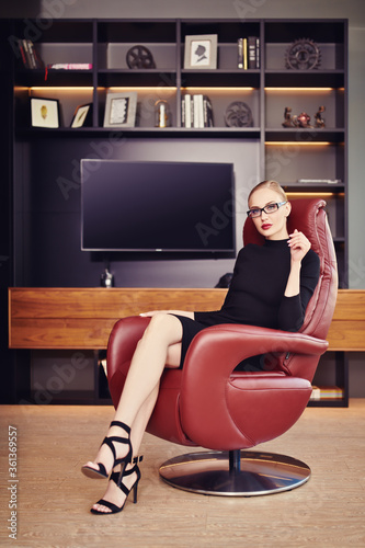 lady in a leather chair