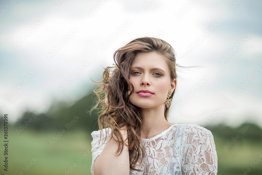 Portrait of a young beautiful woman. Beautiful young green-eyed girl on the nature. Portrait of a young beautiful woman. Beautiful young green-eyed girl on the nature.