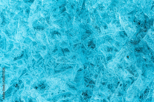 Ice crystals in the form of a blue background. Place for text.