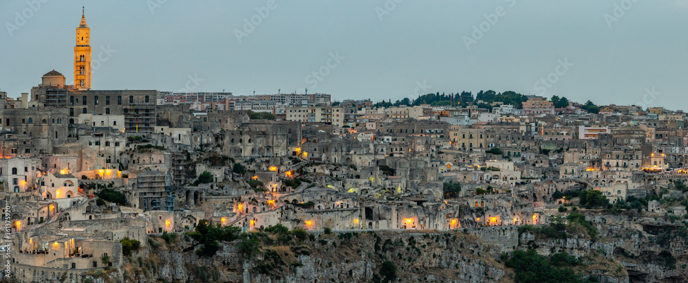 Matera is a city in Italy. The Sassi di Matera, is a complex of cave dwellings carved into the ancient river canyon, often cited as 