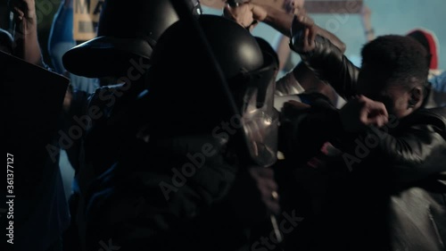 Black Multi-ethnic Men Activists Fighting with the Brutal American Police Officers on Public Rebellion. Street rally. Demonstration. Antiracism. Black Lives Matter.