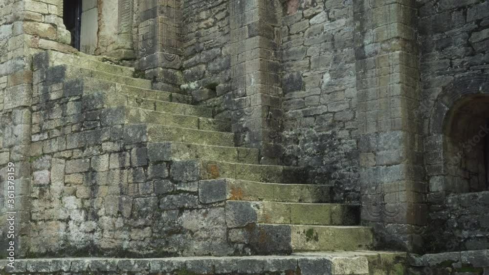 Stone stairs of an ancient historical church and arched window. Antique Masonry. Sightseeing Hiking Stone stairs of an ancient historical church and arched window. Antique Masonry. Sightseeing Hiking