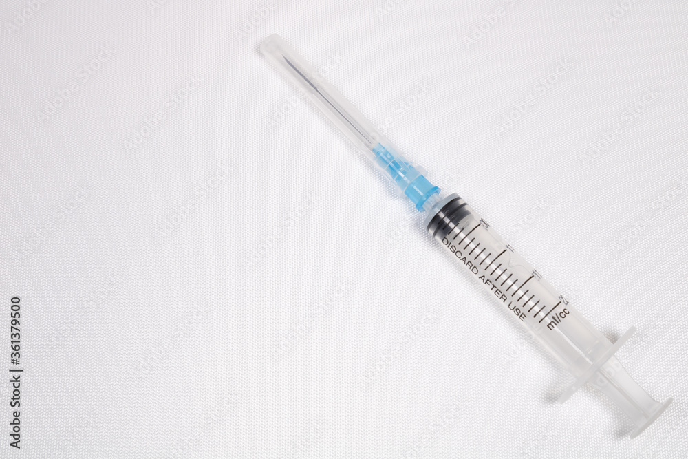 Injection syringes on bleached wood. Background on the theme of medicine. Injection syringes on bleached wood. Background on the theme of medicine.