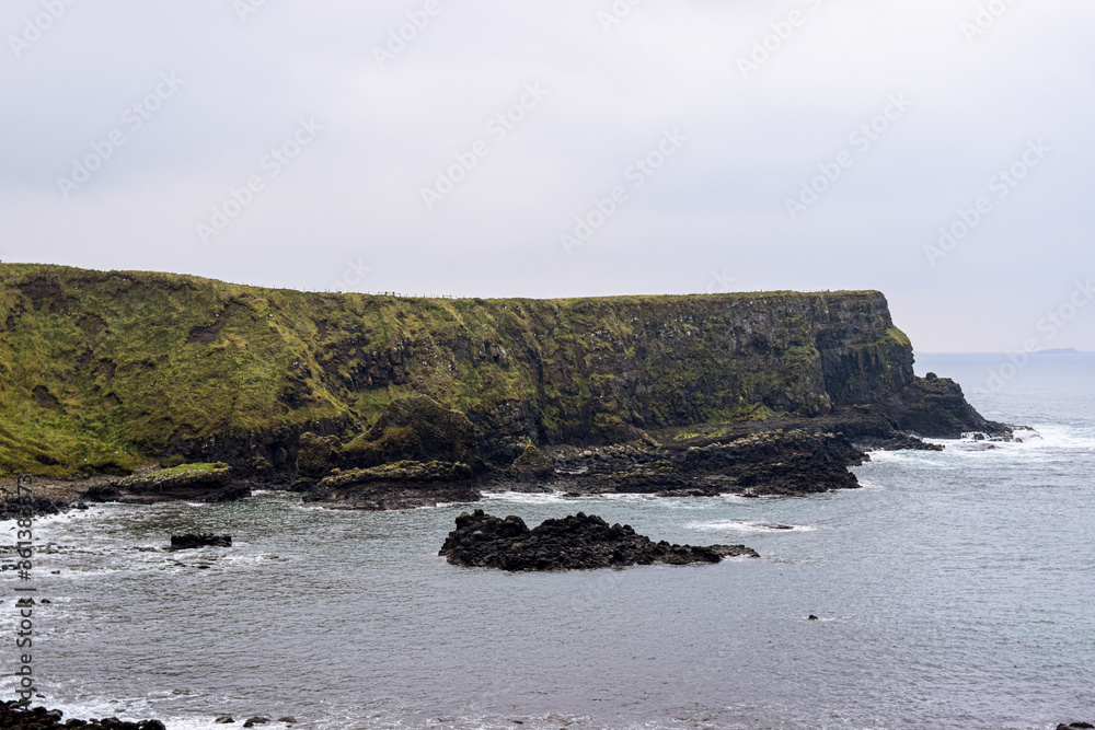 Photo of the beach in Belfast during winter and a cloudy day in the Giants Causeway Photo of the beach in Belfast during winter and a cloudy day in the Giants Causeway