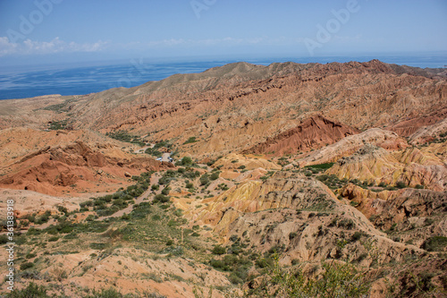 Red canyon valley scenery. Beautiful sunny landscape with sand, rocks and hills. National park summer view