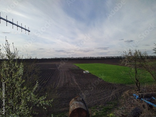 Aerial view of agricultural field at spring day photo