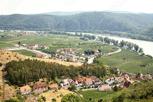 picturesque European town far away. Scenic mountain landscape with small old beautiful village. Danube Valley of the Wachau, Austria.