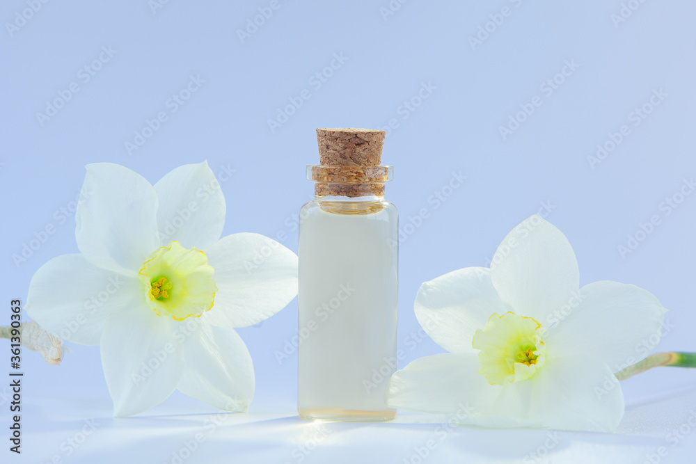Essence of flowers on white in beautiful glass jar Essence of flowers on white in beautiful glass jar