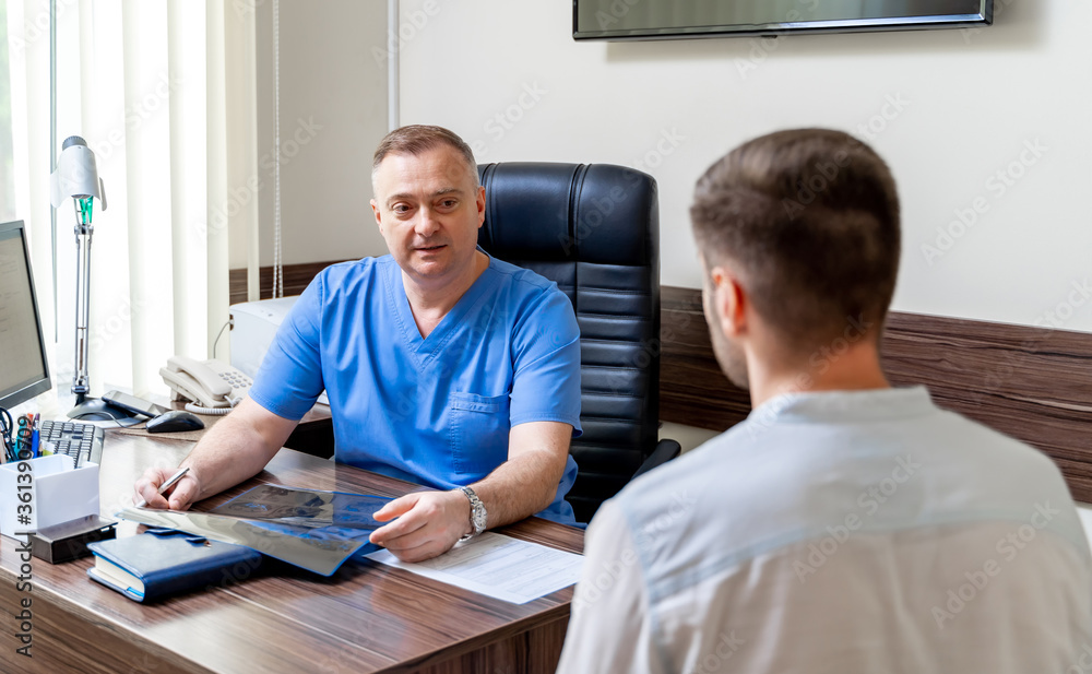 Fototapeta premium Patient is in the doctor's office. Man receives prescription medicine. Realistic images. Selective focus